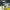 Paint sprayer with built-in alerts and warning labels on a dark background