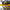 Person using a tool with a 2-in-1 rdewalt cordless grease gun on a forklift.